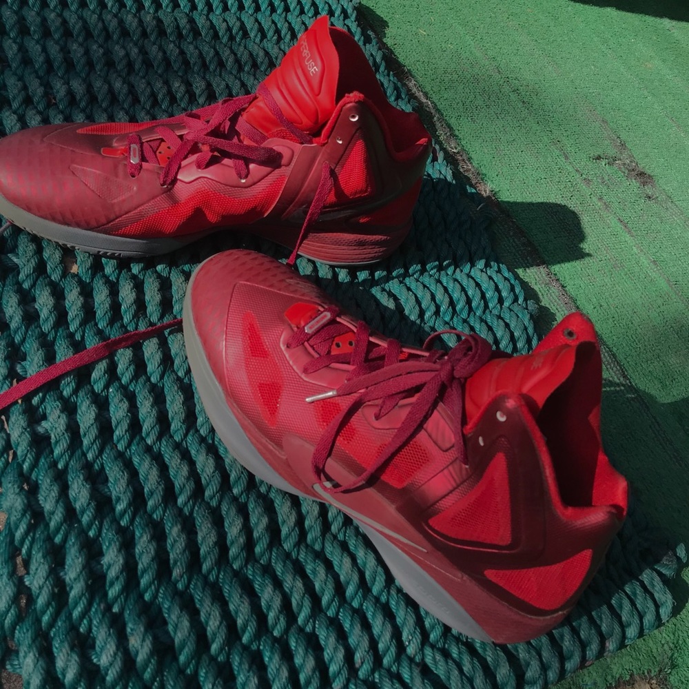 red and maroon Nike hyperfusion